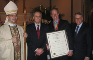Mark Lutes Receives the Caritas Award [Left to Right: Archbishop Weurl, Doug Hastings, Mark Lutes, and Steven Epstein.]